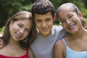 Hispanic siblings hugging